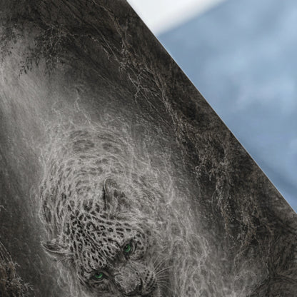 Detailed grayscale drawing of a snow leopard with bright green eyes emerging from misty foliage.