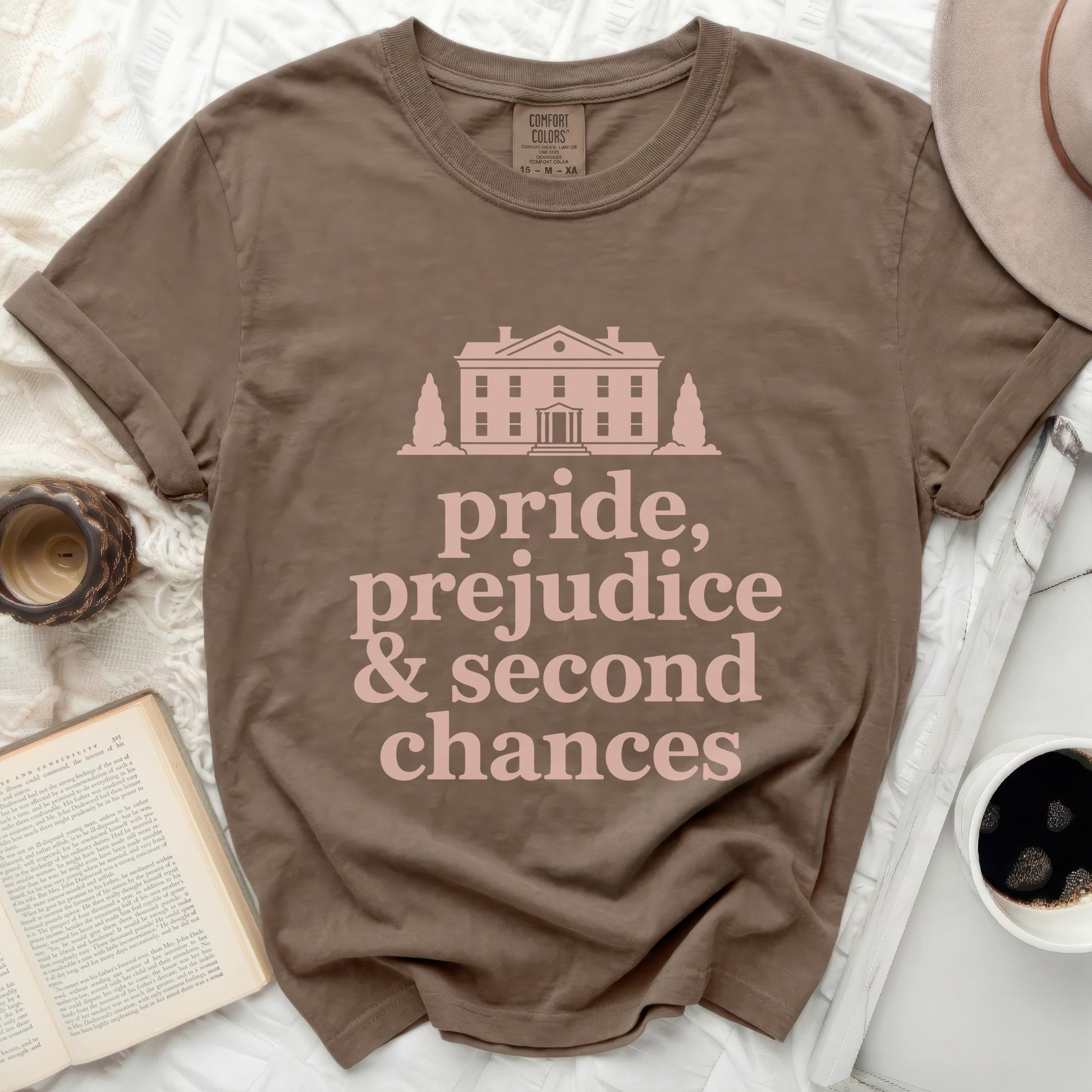 Brown t-shirt with "pride, prejudice & second chances" text.