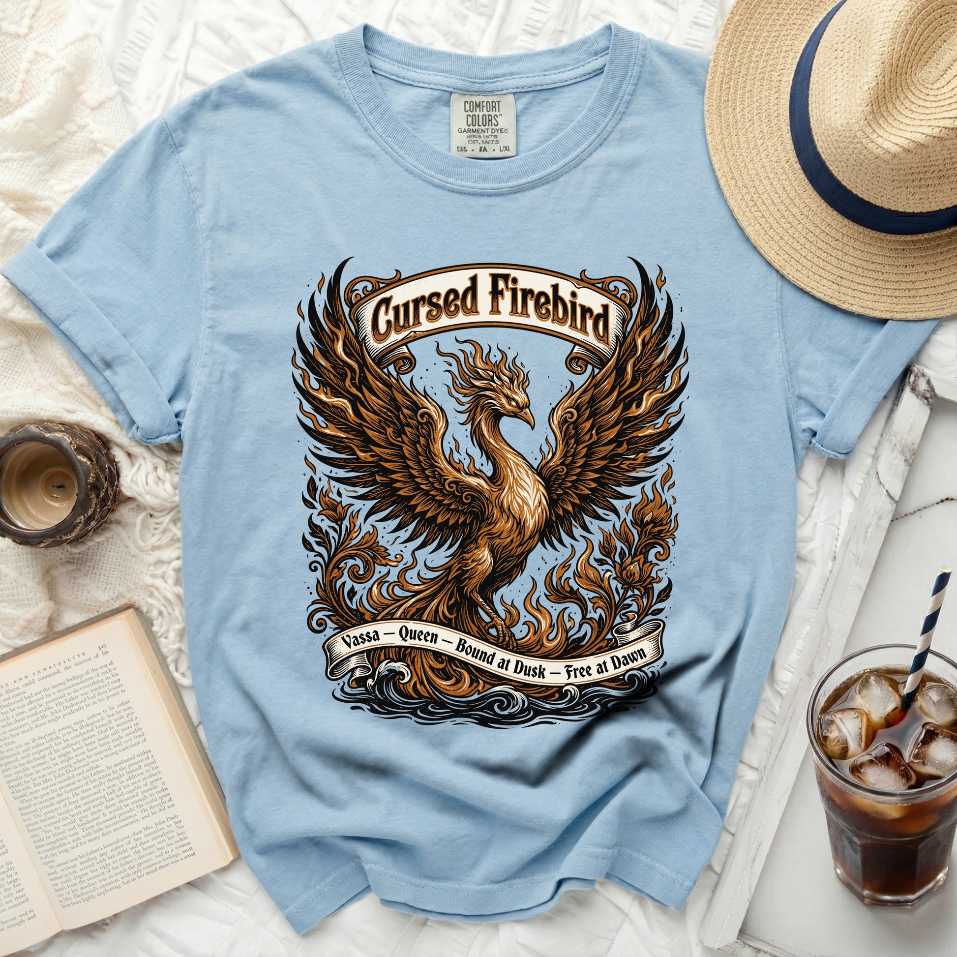Light blue t-shirt with "Cursed Firebird" graphic of a phoenix.