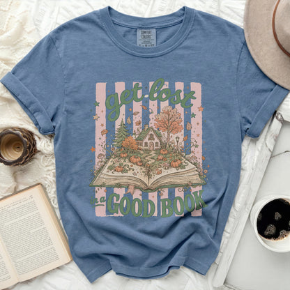 Blue t-shirt with "get lost in a good book" autumn forest design.