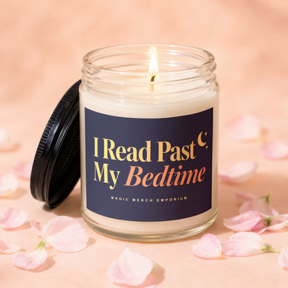 Candle with "I Read Past My Bedtime" text and a lit wick, surrounded by pink petals.