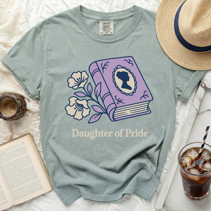 T-shirt with purple book graphic and "Daughter of Pride" text.