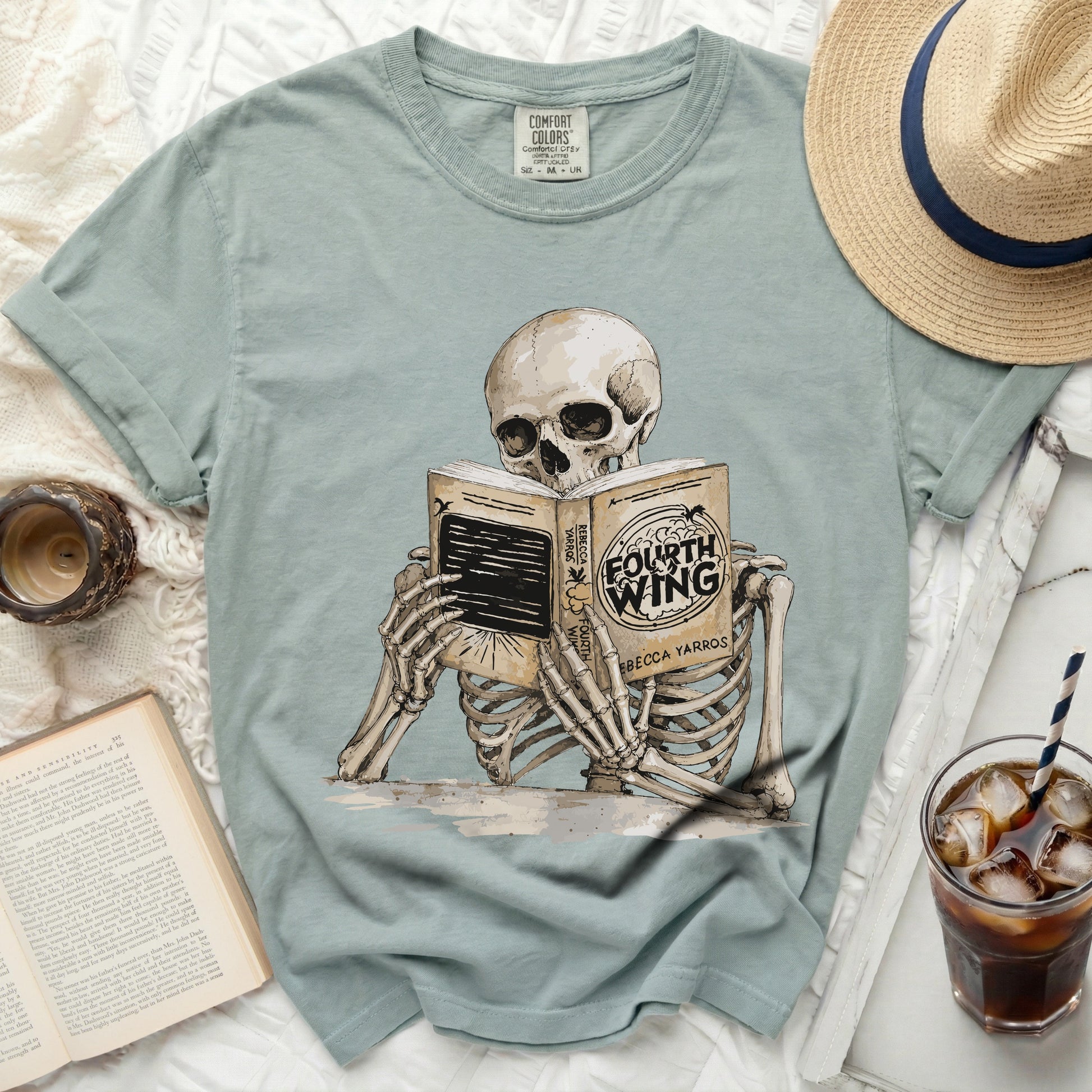 Skeleton reading "Fourth Wing" by Rebecca Yarros on a t-shirt.