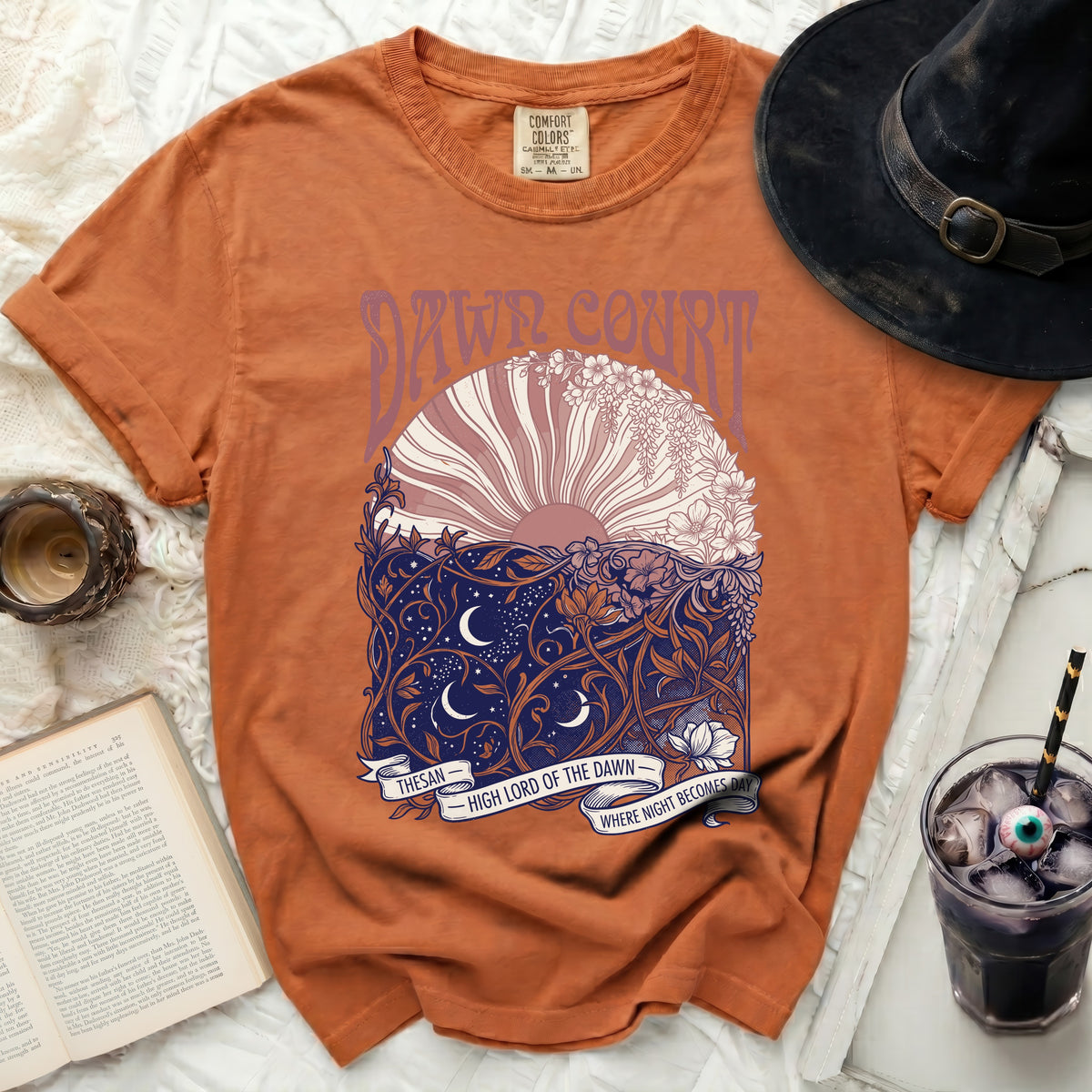 Orange t-shirt with "Dawn Court" and celestial design.