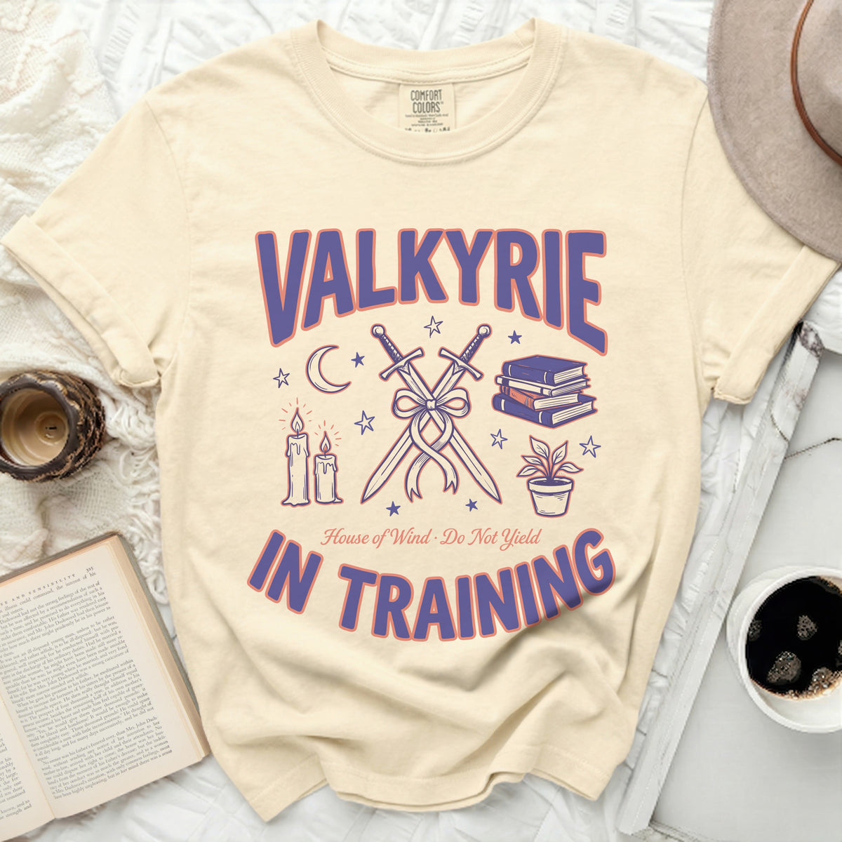 Cream t-shirt with "Valkyrie in Training" and sword graphic.