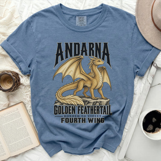 Blue t-shirt with "Andarna Golden Feathertail" dragon design.