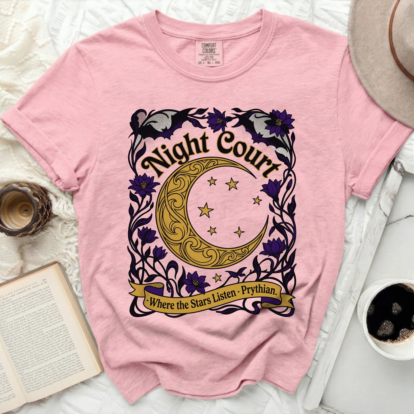 Pink t-shirt with "Night Court Where the Stars Listen. Prythian" graphic.