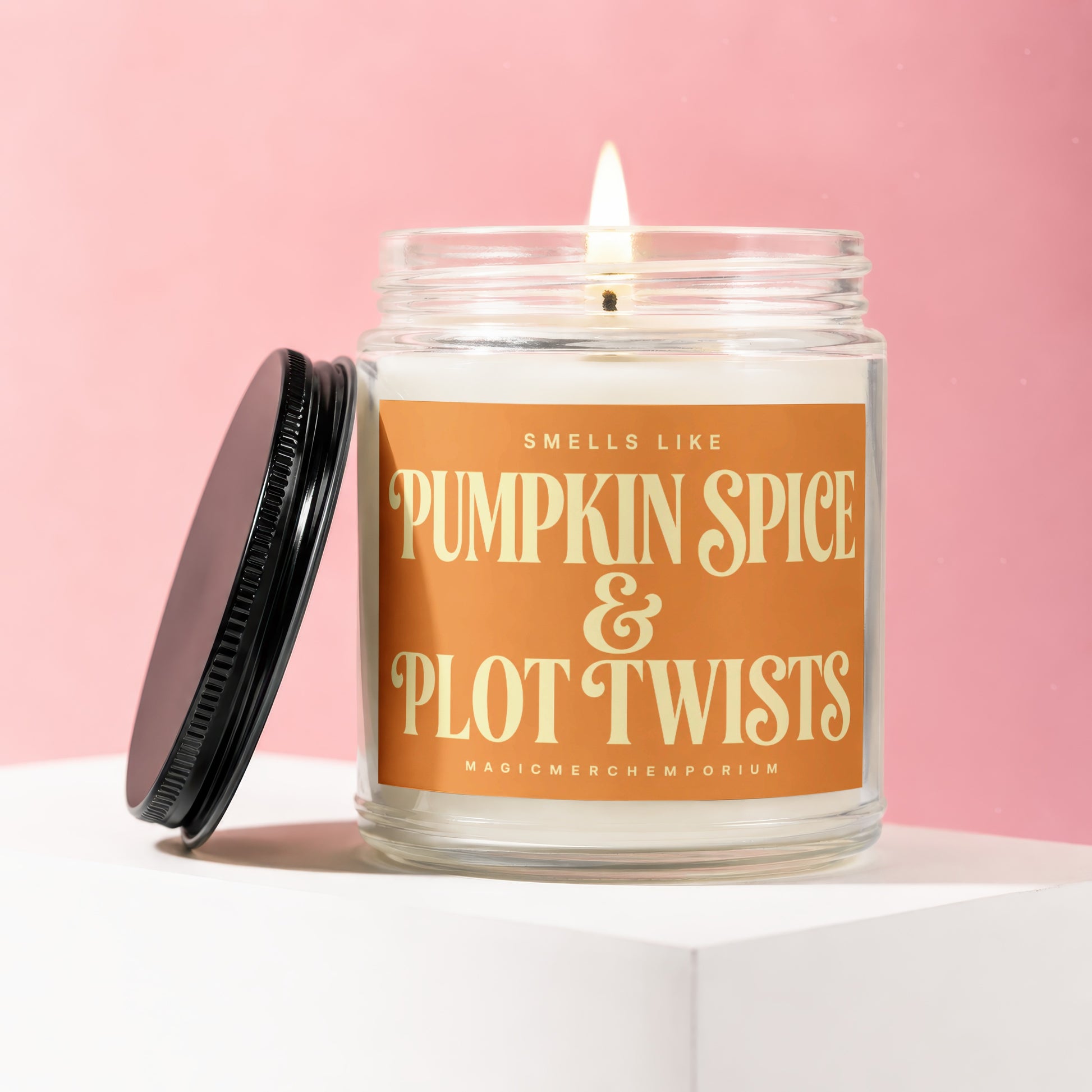 Candle with label "Smells Like Pumpkin Spice & Plot Twists"