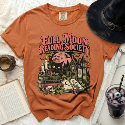 Orange t-shirt with "Full Moon Reading Society" graphic featuring a black cat and spooky house.