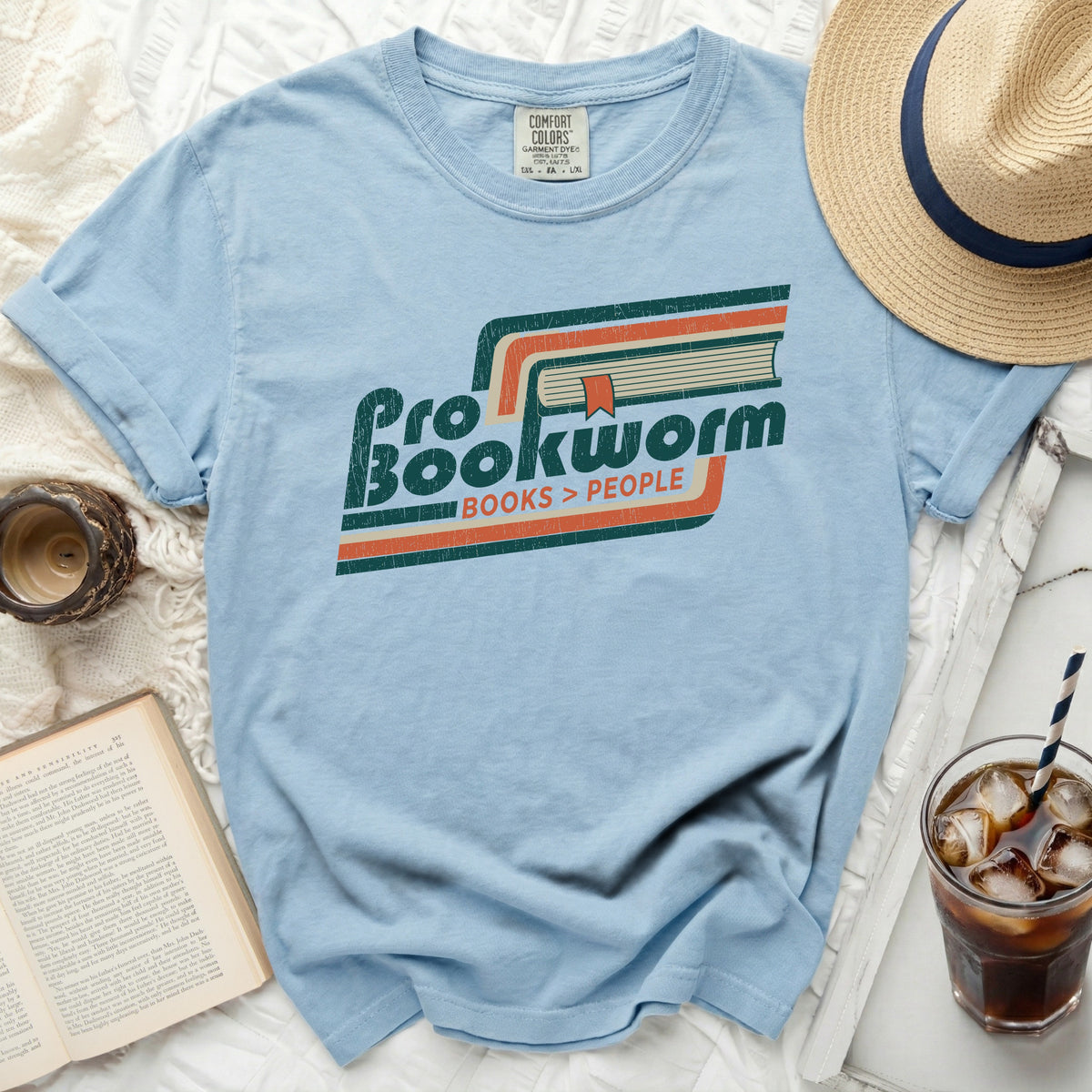 Light blue t-shirt with "Pro Bookworm Books > People" graphic and vintage stripes.