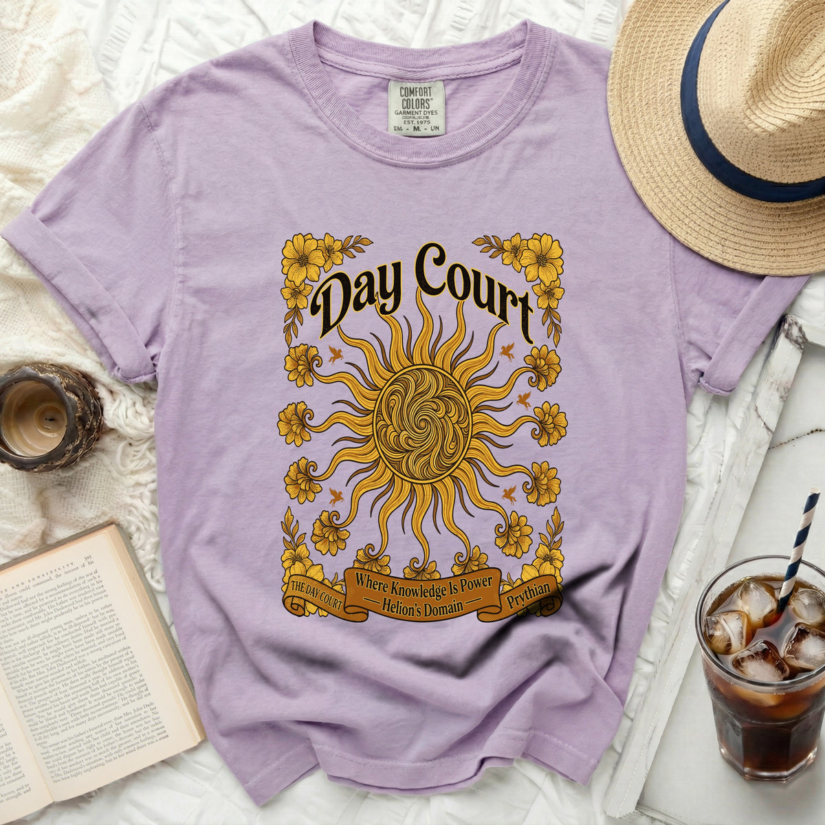 Lavender t-shirt with "Day Court" text, sun, and floral design.