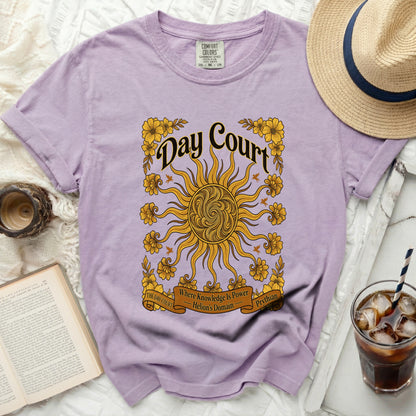 Lavender t-shirt with "Day Court" text, sun, and floral design.