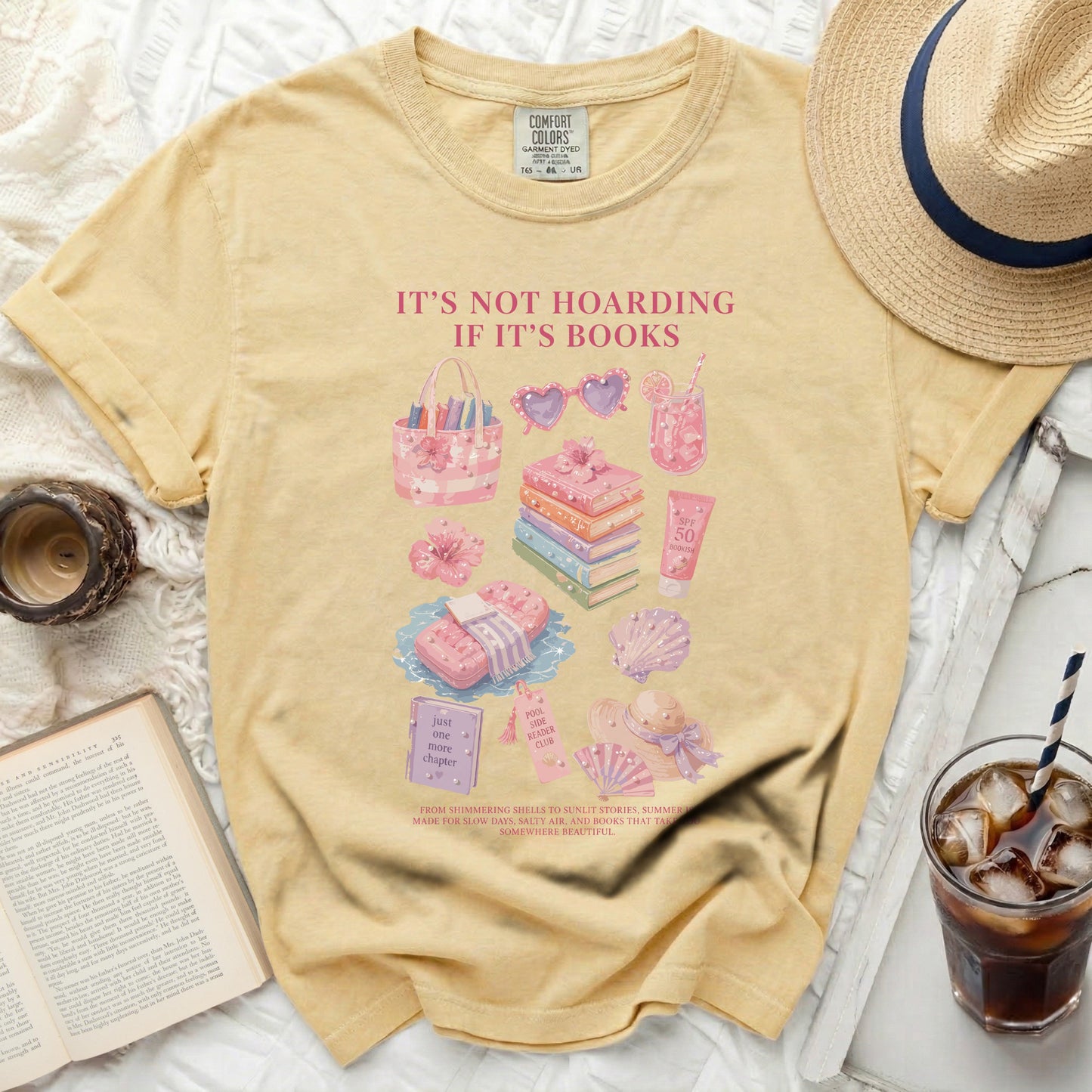 Yellow t-shirt with bookish summer graphics and text: "IT'S NOT HOARDING IF IT'S BOOKS."