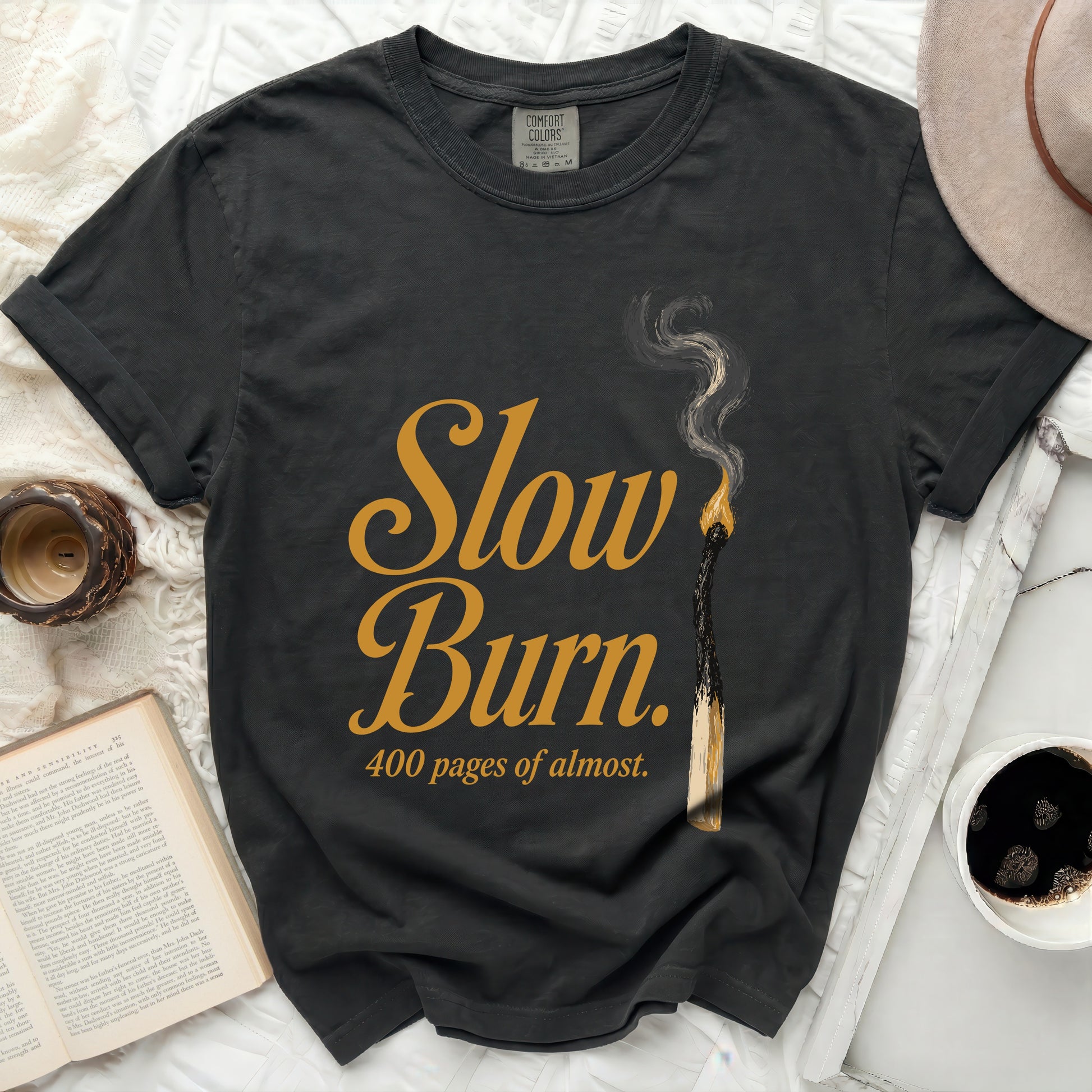 Black t-shirt with "Slow Burn. 400 pages of almost." text.
