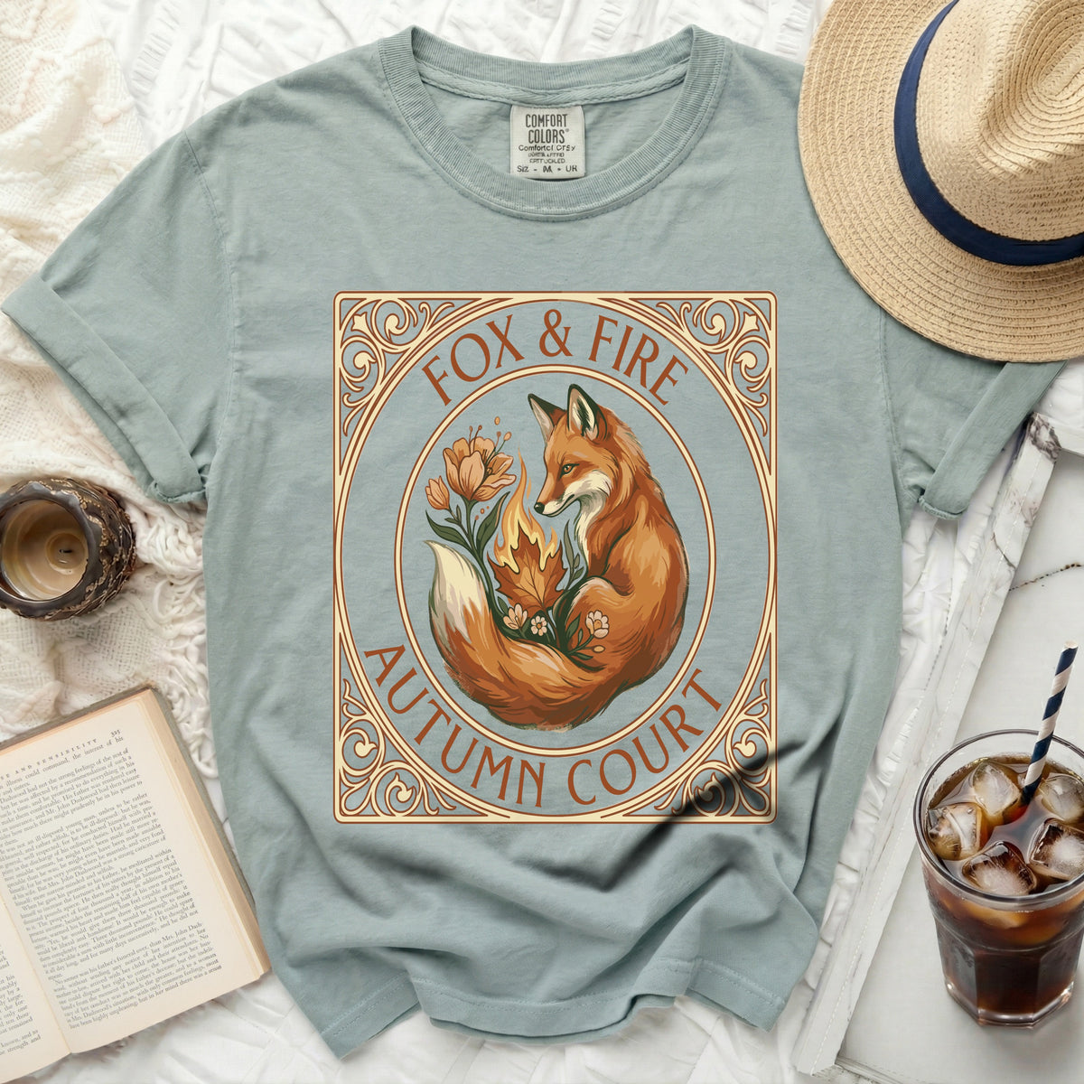 Green t-shirt with a fox, fire, and floral design that reads "Fox & Fire Autumn Court".