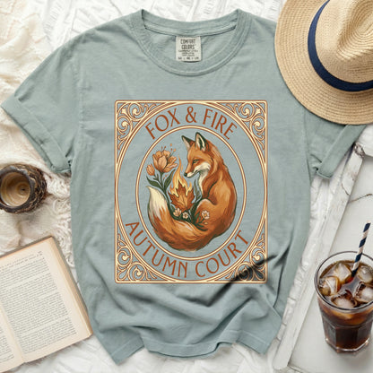 Green t-shirt with a fox, fire, and floral design that reads "Fox & Fire Autumn Court".