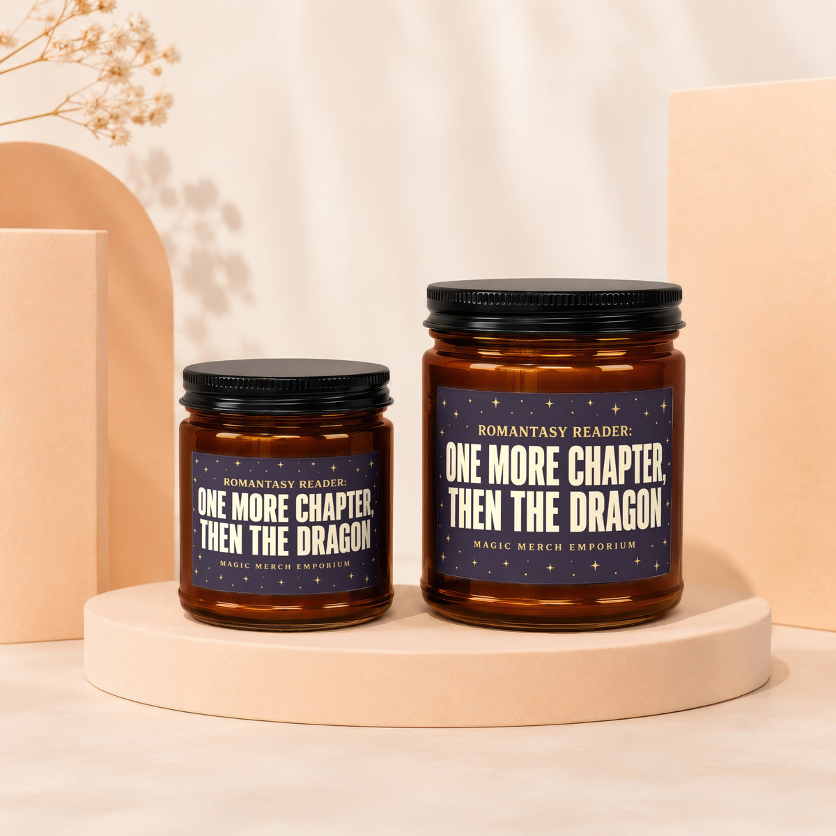 Two amber glass candles with dark labels reading "One More Chapter, Then The Dragon."