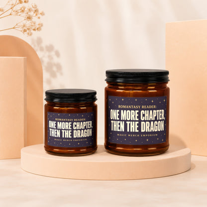 Two amber glass candles with dark labels reading "One More Chapter, Then The Dragon."
