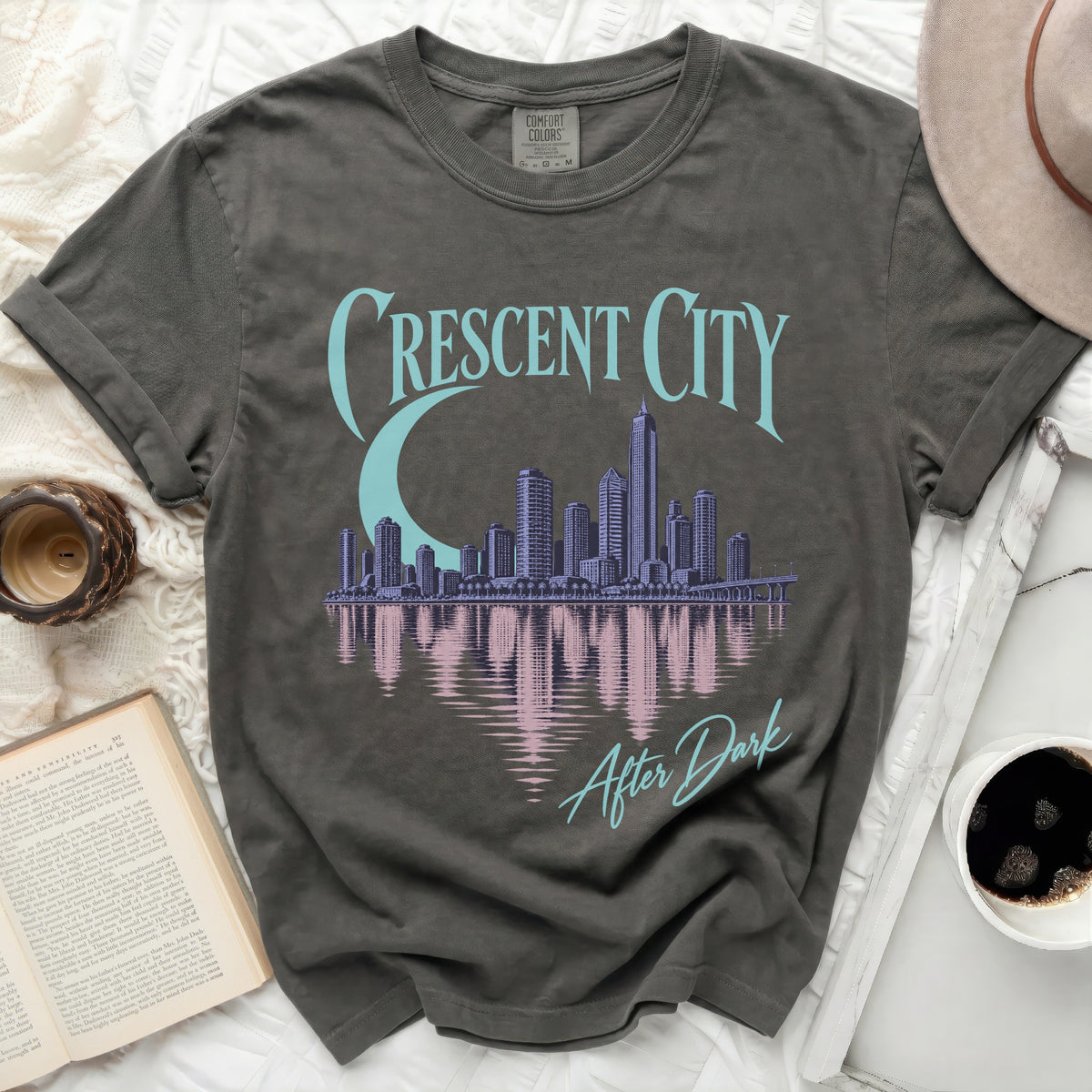 Grey t-shirt with "Crescent City" text, city skyline, and moon graphic.