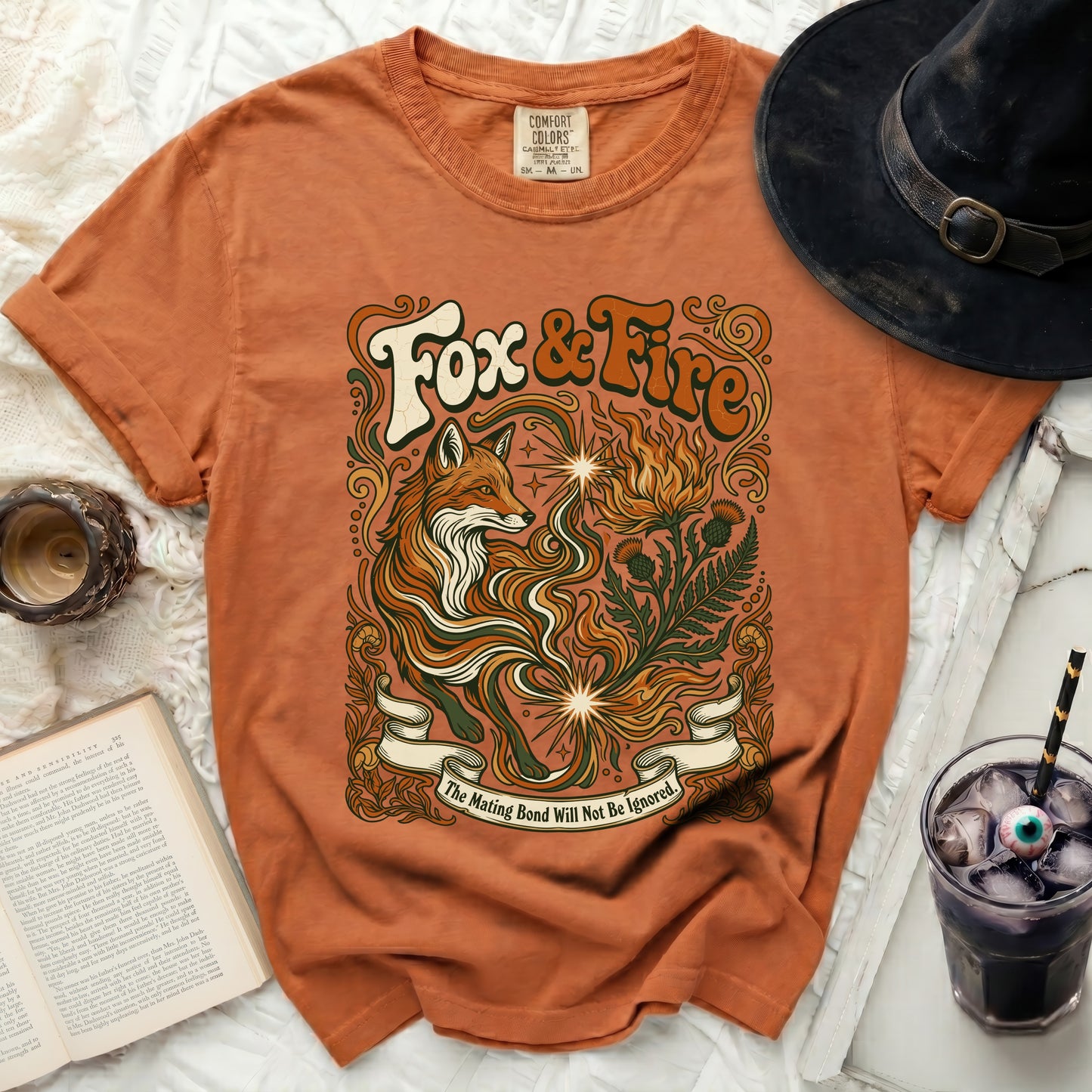 Orange t-shirt with "Fox & Fire" and fox graphic, "The Mating Bond Will Not Be Ignored."