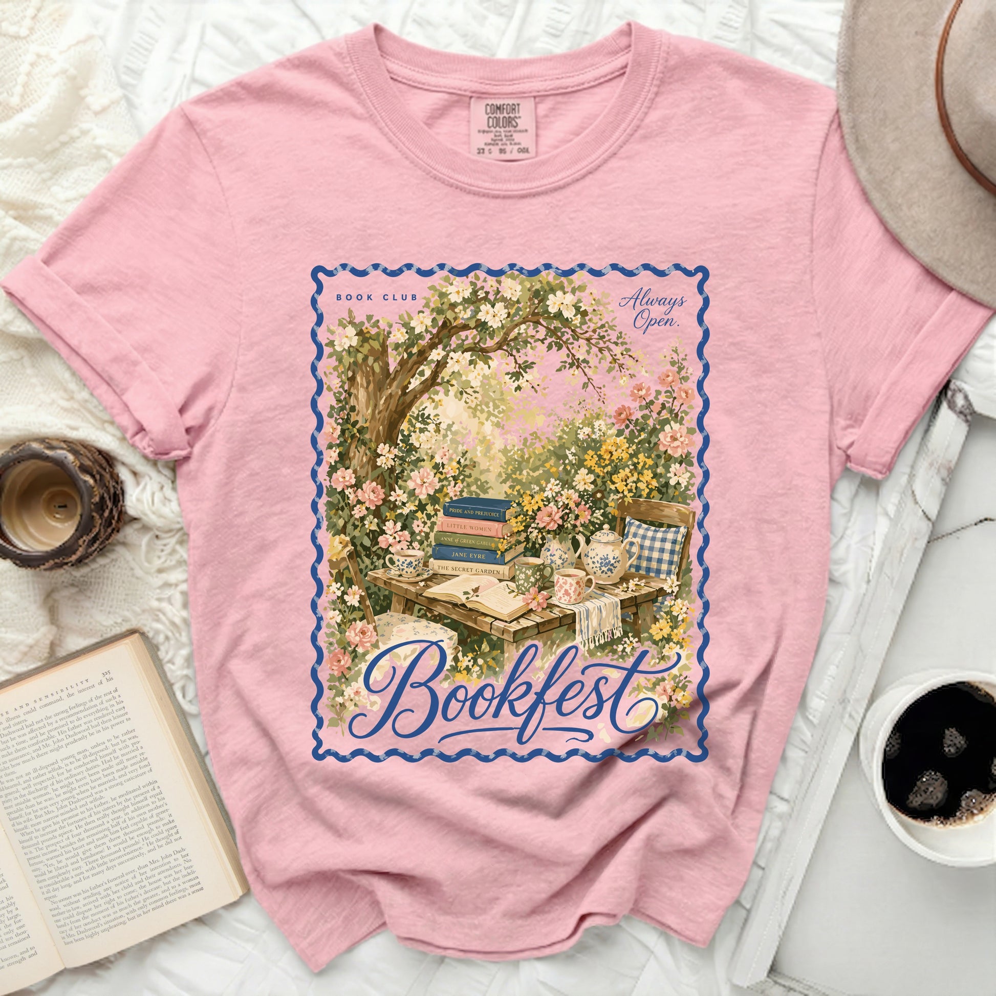 Pink t-shirt with "Bookfest" and garden scene graphic.