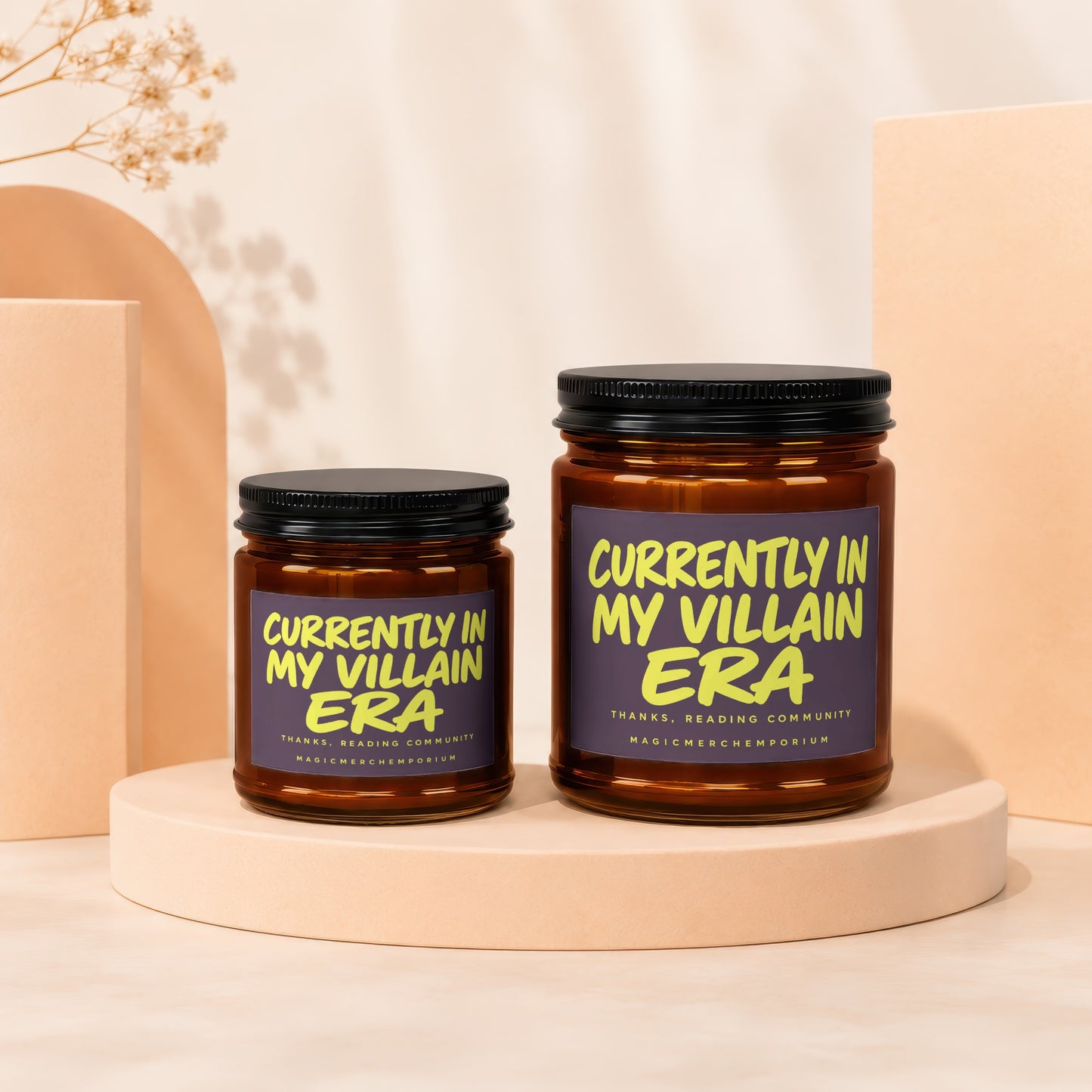 Two candles with "Currently in my villain era" text on a light-colored background.