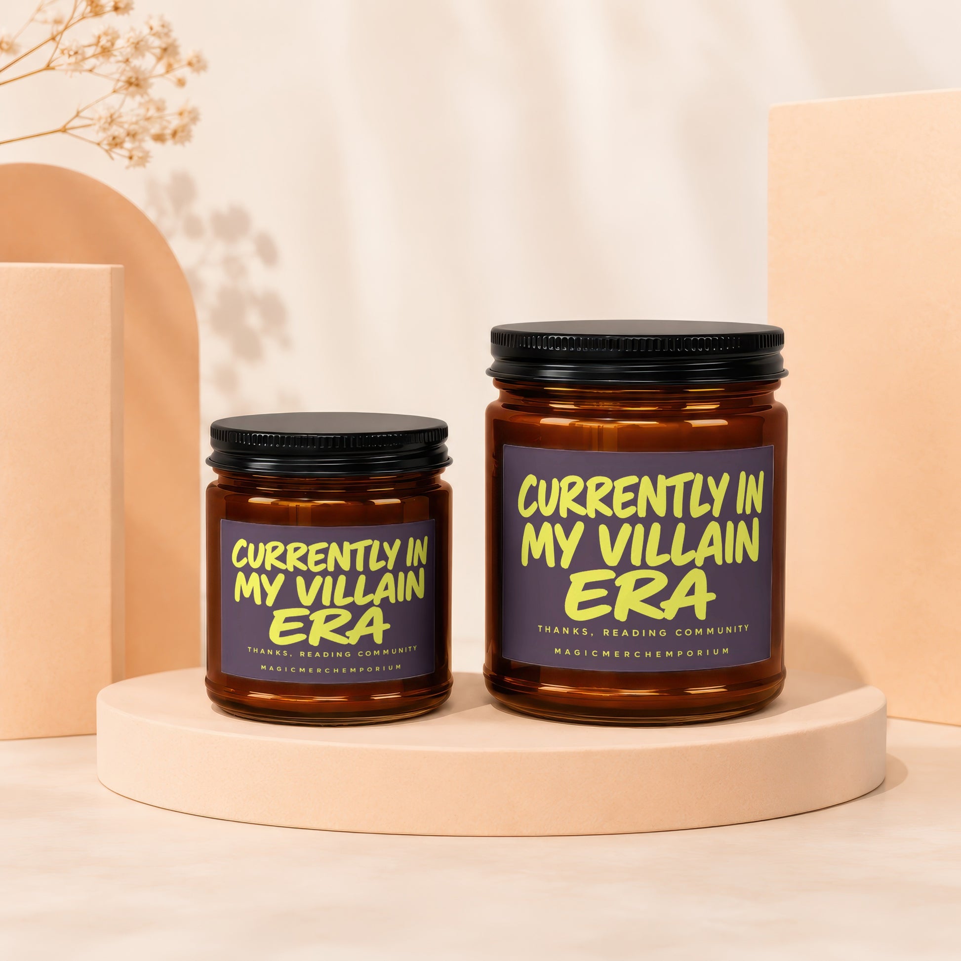 Two candles with "Currently in my villain era" text on a light-colored background.
