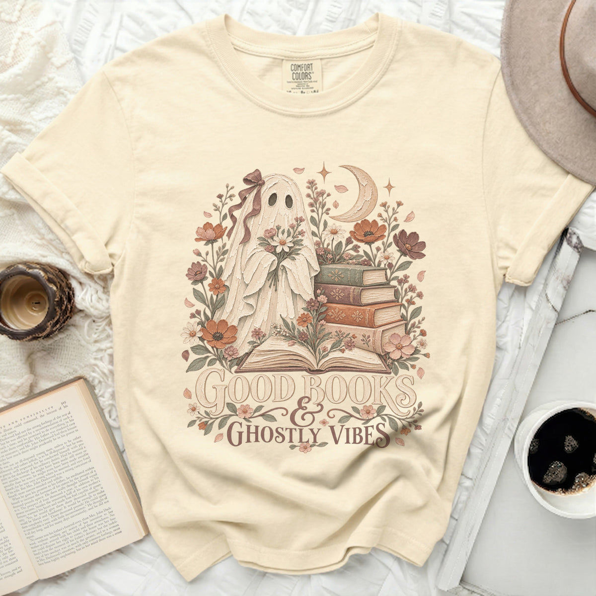 Cream t-shirt with a ghost holding flowers and text "Good Books & Ghostly Vibes."