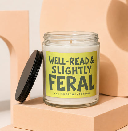 Glass candle with a lime green label reading "WELL-READ & SLIGHTLY FERAL".