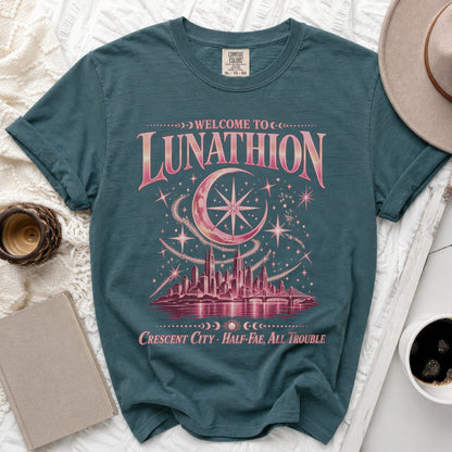 Teal t-shirt with "Welcome to Lunathion Crescent City Half-Fae, All Trouble" text and celestial cityscape.