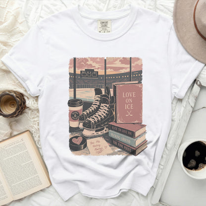 T-shirt featuring hockey skates, books, and coffee cups with "Love on Ice" theme.