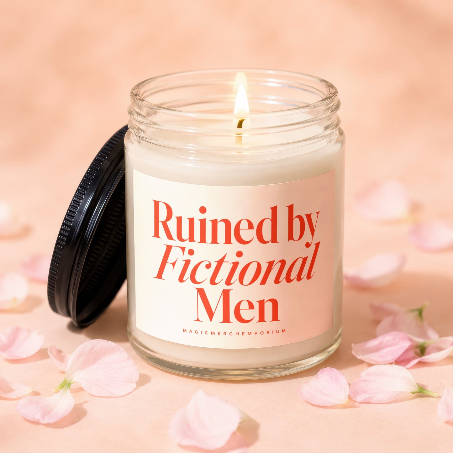 Candle with red text "Ruined by Fictional Men" on cream label.