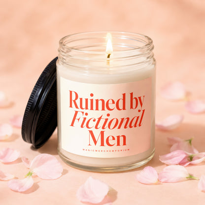 Candle with red text "Ruined by Fictional Men" on cream label.