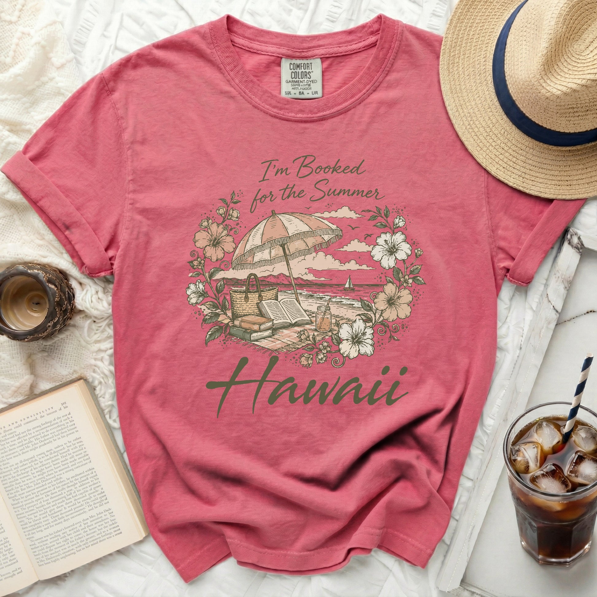 Pink t-shirt with "I'm Booked for the Summer Hawaii" graphic.