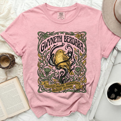 Pink t-shirt with art nouveau design featuring a bird and text.