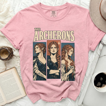 Pink t-shirt with "THE ARCHERONS" text and three illustrated women.