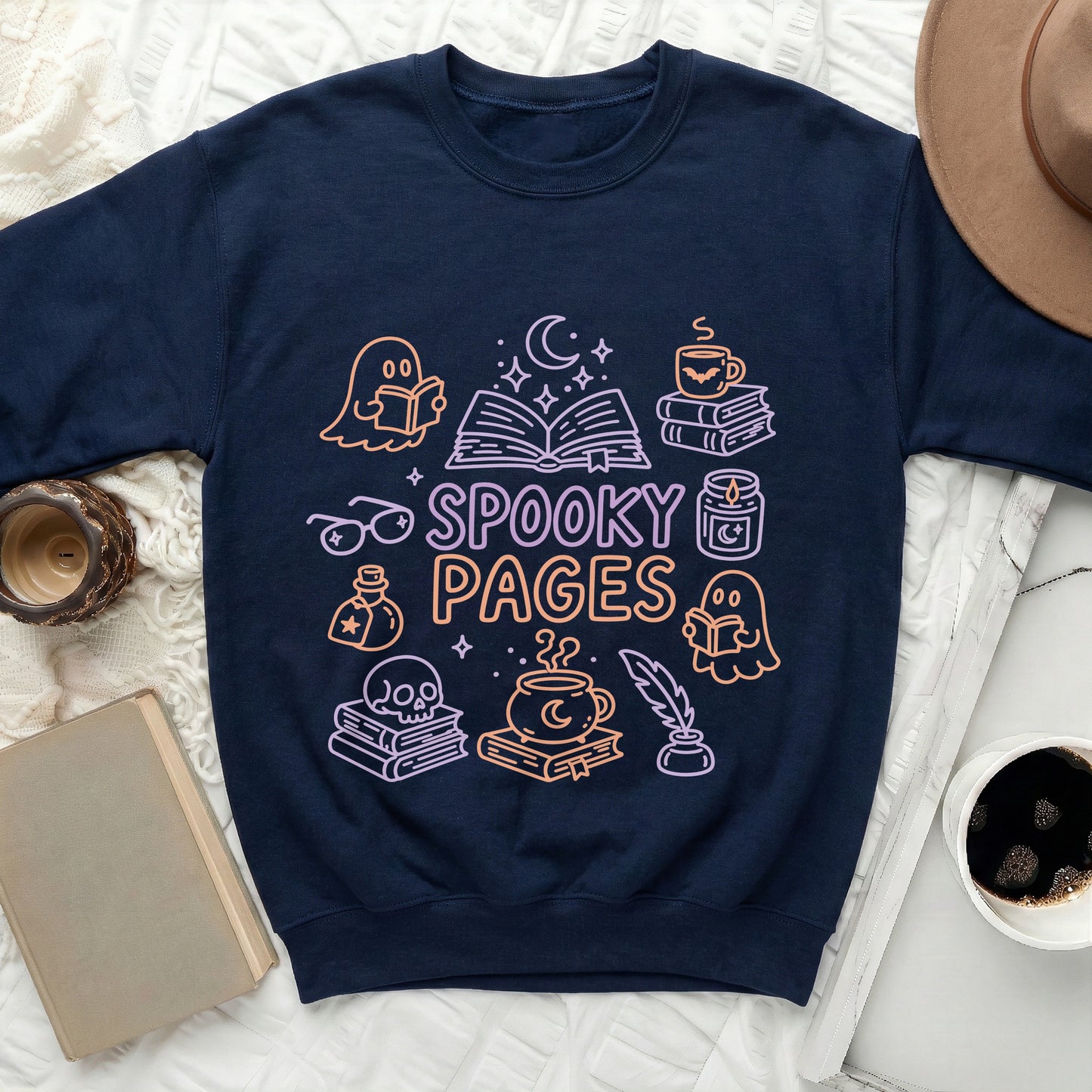 Navy sweatshirt with "Spooky Pages" text and Halloween-themed book illustrations.