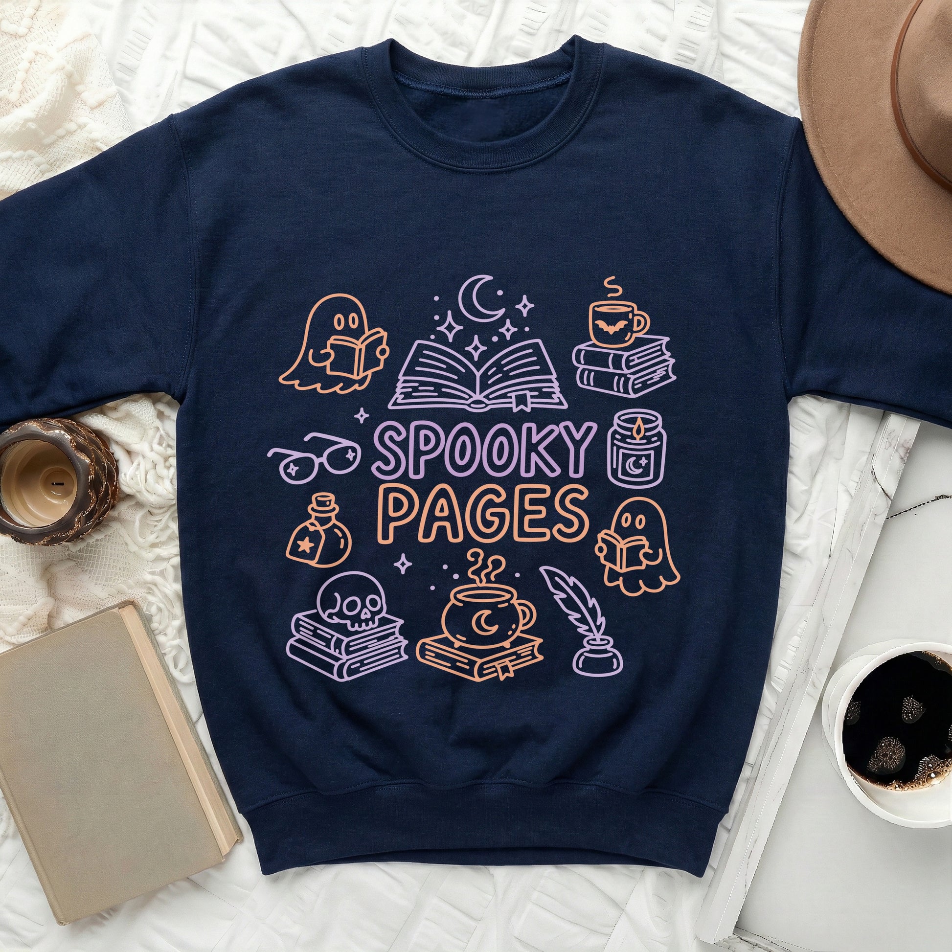 Navy sweatshirt with "Spooky Pages" text and Halloween-themed book illustrations.