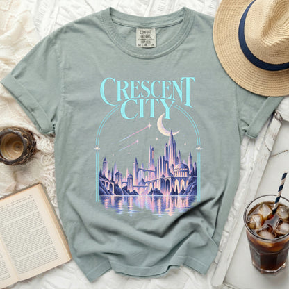 Light blue t-shirt with "CRESCENT CITY" graphic of a futuristic city.