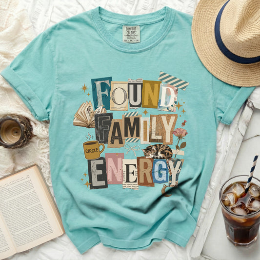 Found Family Energy graphic tee with distressed letters and illustrations.