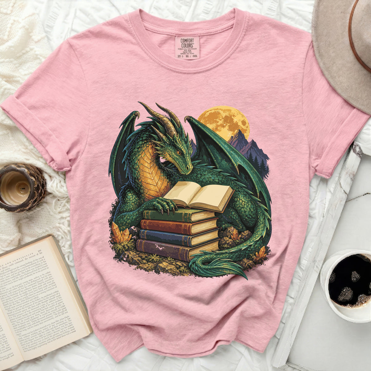 Green dragon reading books under a full moon and mountains.