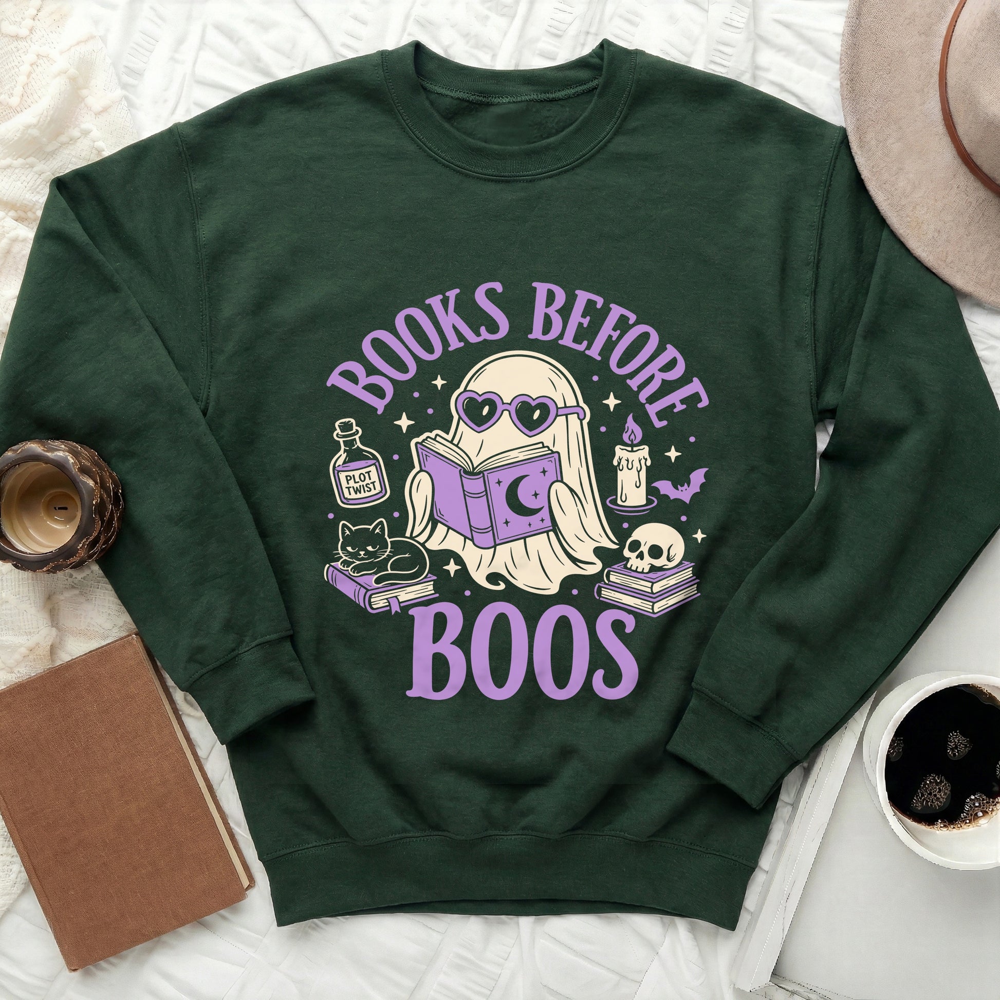 Dark green sweatshirt with "Books Before Boos" ghost reading design and Halloween icons.