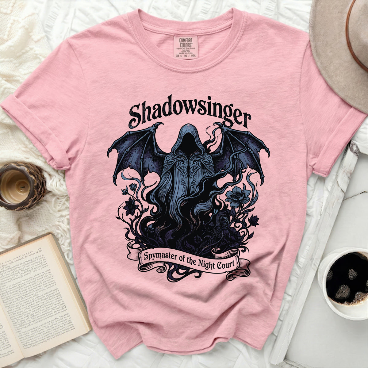 Pink t-shirt with "Shadowsinger Spymaster of the Night Court" graphic.