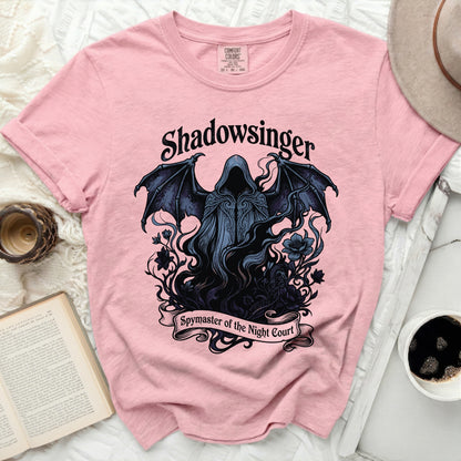 Pink t-shirt with "Shadowsinger Spymaster of the Night Court" graphic.