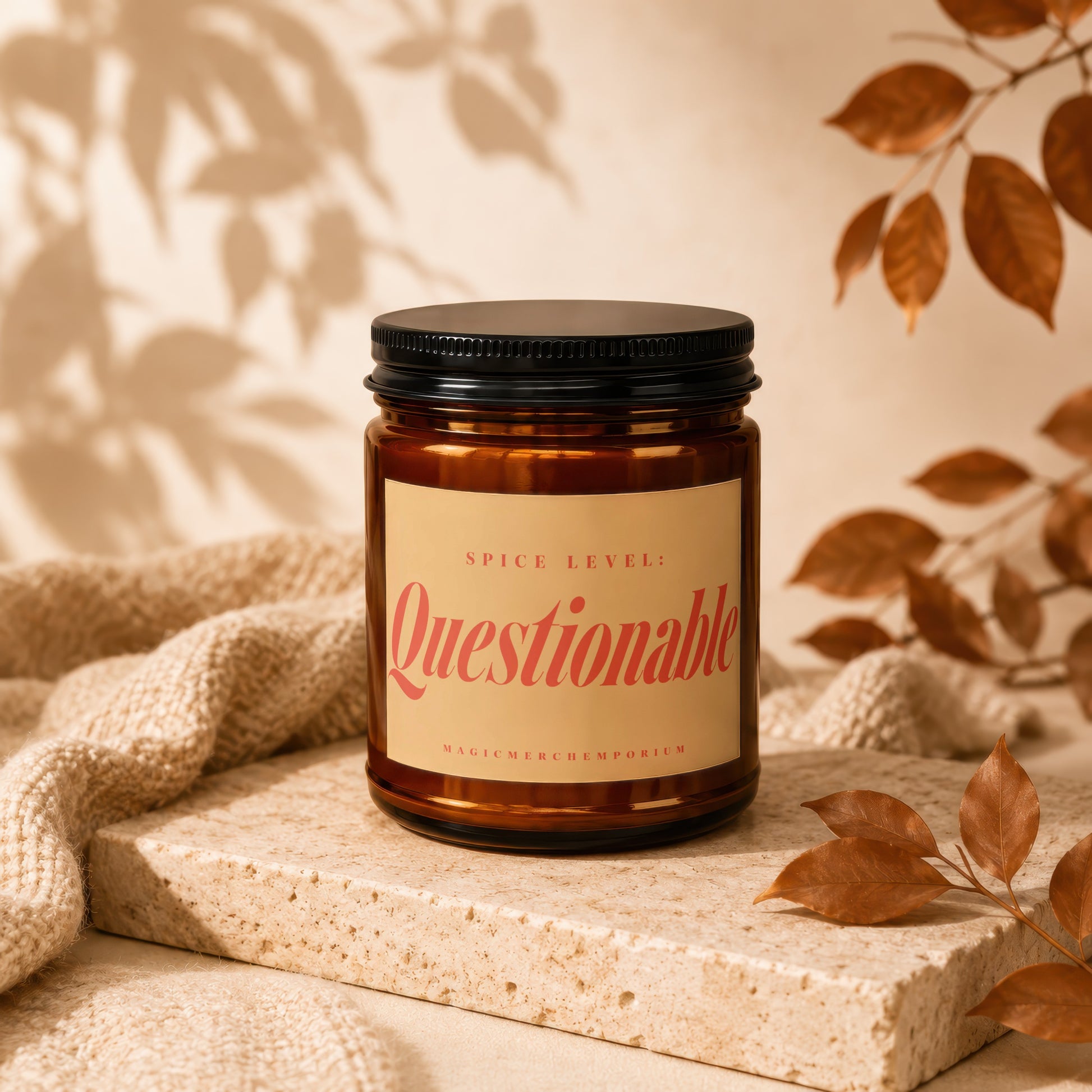 Brown glass candle with black lid labeled "Spice Level: Questionable."
