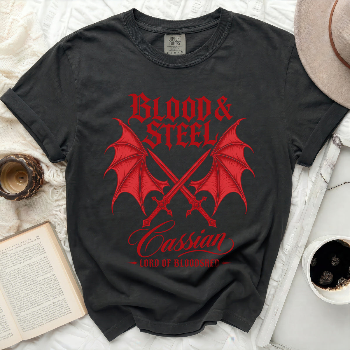 Black t-shirt with red "Blood & Steel Cassian Lord of Bloodshed" dragon wings and swords graphic.