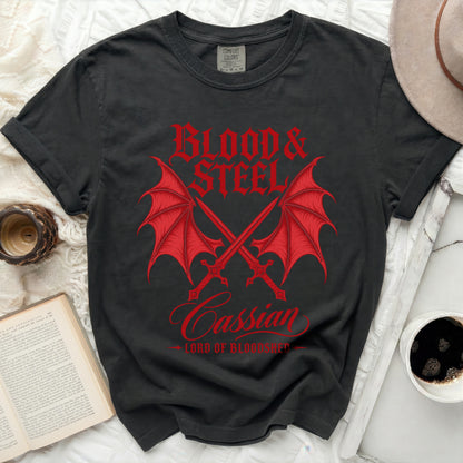 Black t-shirt with red "Blood & Steel Cassian Lord of Bloodshed" dragon wings and swords graphic.