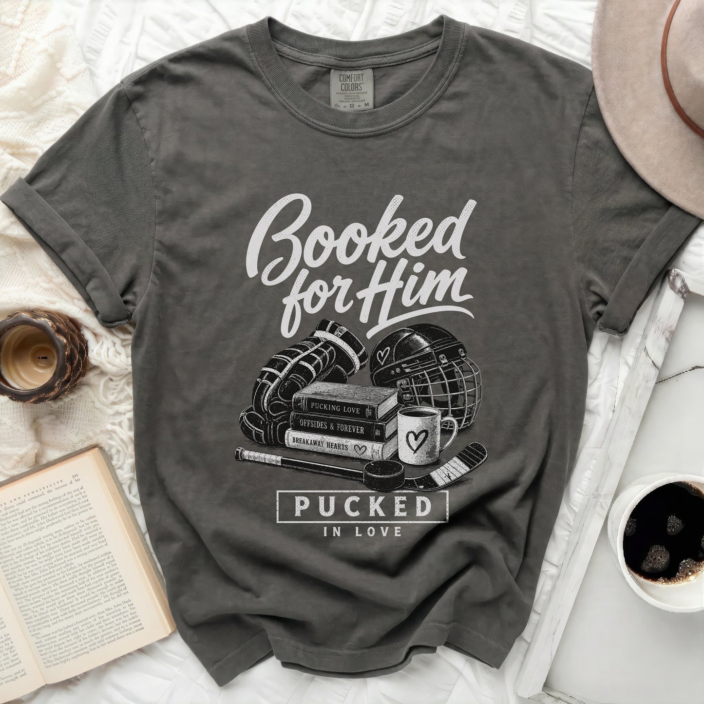 Dark grey t-shirt with "Booked for Him" and hockey graphics.