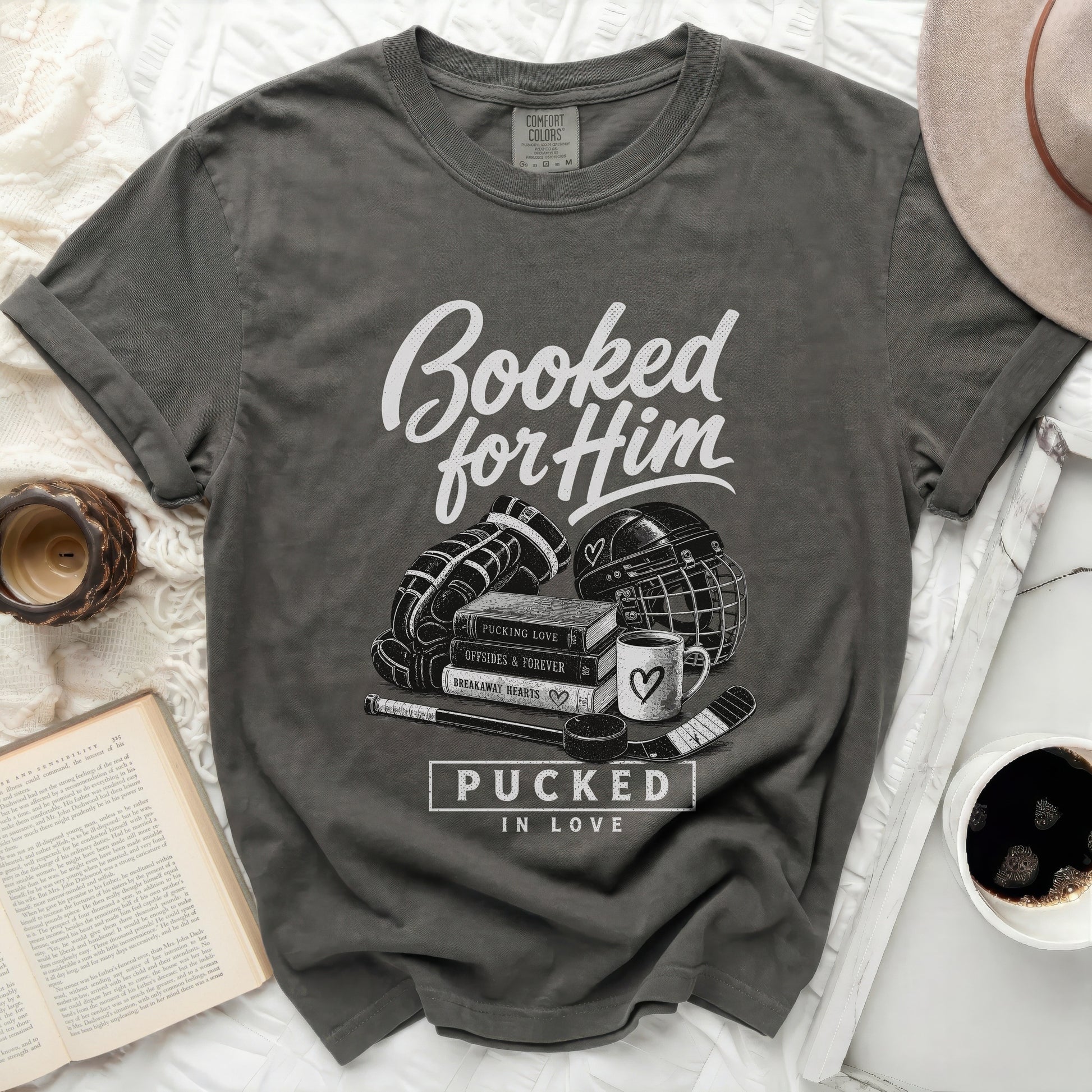 Dark grey t-shirt with "Booked for Him" and hockey graphics.
