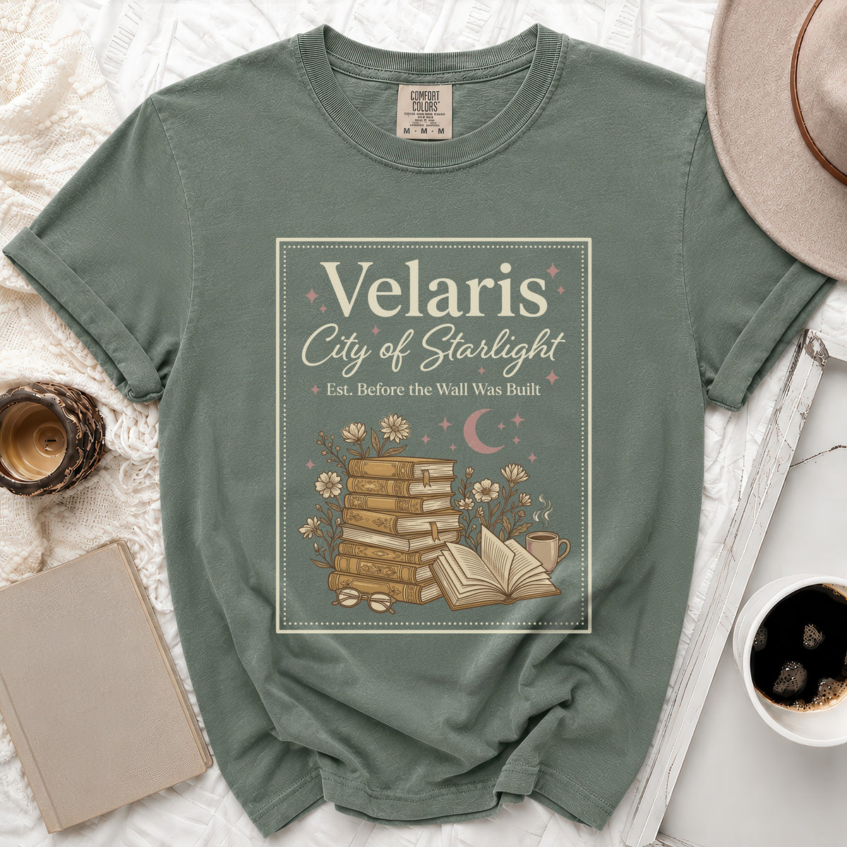 Green t-shirt with "Velaris City of Starlight Est. Before the Wall Was Built" text and book graphic.